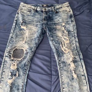 Acid washed ripped jeans.